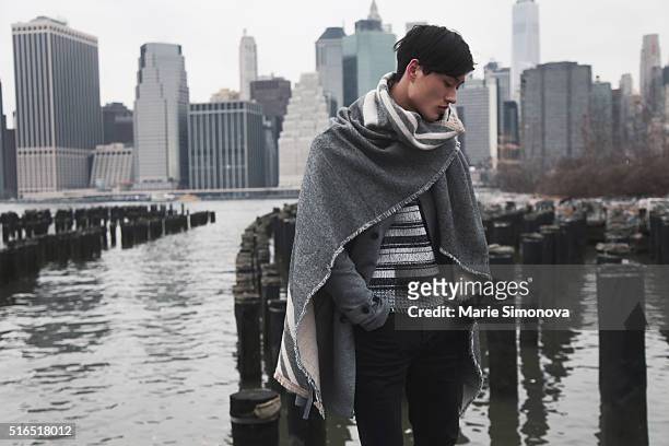 Chen Cong wearing long Zara Man grey scarf and grey Zara Man jacket, striped H&M black and white sweater seen on March 10, 2016 in New York City.