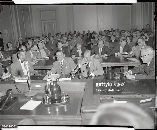 Photo shows Artie Shaw as he wipes the tears from his eyes during testimony. He shed a few tears while recounting his rise to fame from a poor...