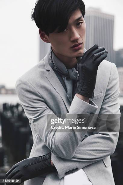 Chen Cong wearing grey jacket, white T-shirt, grey scarf and black trousers by Zara Man seen on March 10, 2016 in New York City.