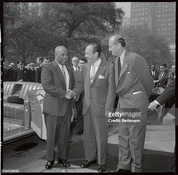 The President of Sudan, is greeted by Mayor Wagner in this photograph, as he shook his hand upon arriving at City Hall, after a ticket tap parade up...