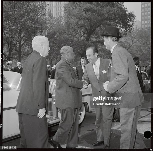 The President of Sudan, is greeted by Mayor Wagner in this photograph, as he shook his hand upon arriving at City Hall, after a ticket tap parade up...