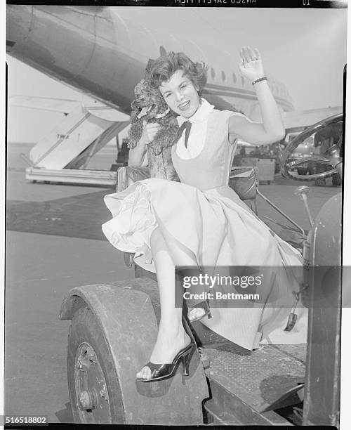 New York, New York. Desert Song. Las Vegas singing engagement is ahead for Eileen Barton, showing just before boarding skyliner at LaGuardia Field.