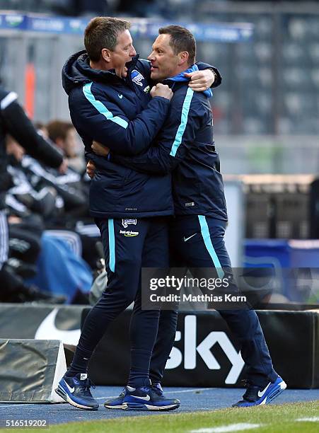 Head coach Pal Dardai of Berlin and assistant coach Rainer Widmayer show their delight after winning the Bundesliga match between Hertha BSC and FC...