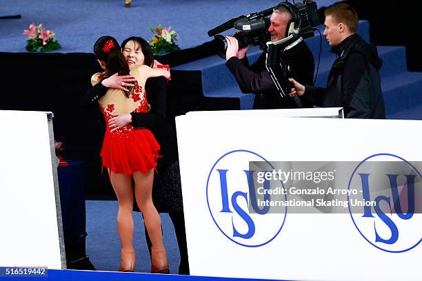 Marin Honda From Japan ebraces her coach after her show during the Ladie's Free Skating program of the ISU World Junior Figure Skating Championships...