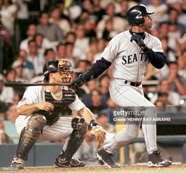 Seattle Mariners' Ken Griffey Jr. Watches his opposite field three-run home run off the New York Yankees David Wells sail over the left field wall in...