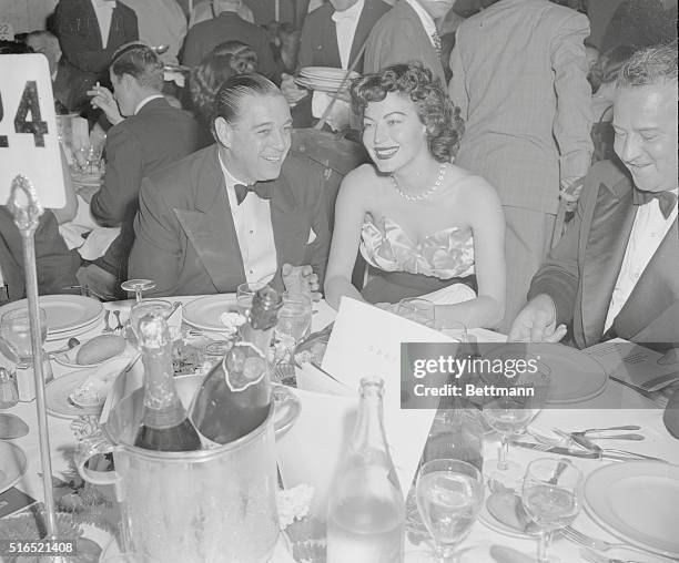 New York, New York: Democratic National Committee Dinner. Waldorf Astoria. Moviestar Ava Gardner with singer Morton Downey at table at Waldorf at...