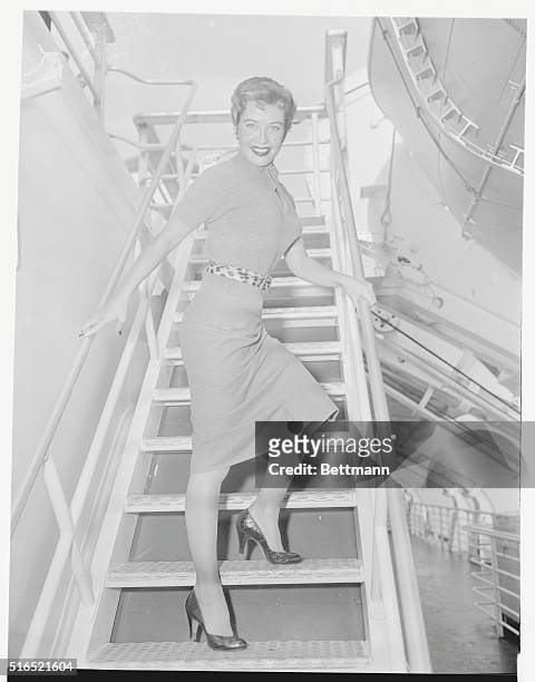 Shipshape, Ahoy! New York, New York: Film star Gloria DeHaven, feeling "dan-dan-dandy" after her European trip, cuts quite a figure for photographers...