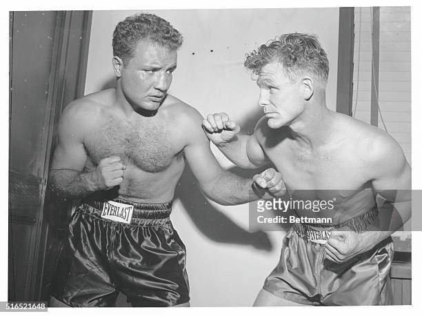 Prize fighters "Irish" Bob Murphy and Jake LaMotta sparring for reporters after weigh-in before the fight at Yankee Stadium.