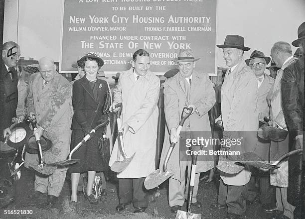 Begin Spadework for Al Smith Houses. New York, New York: Governor Dewey is ably assisted by , Richmond Borough President Cornelius Hall, Mrs. Emily...