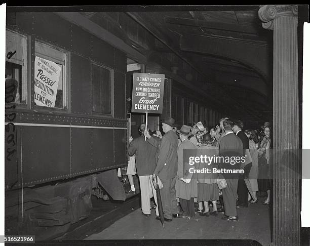 This photo shows protesters entering train for a trip to Washington DC on the B & O Railroad from Jersey City. They are sympathizers of Julius and...