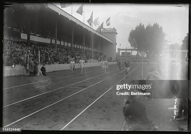 This is a scene at the Olympics in Antwerp with Rudd of South Africa finishing the 400 meter race, and he wins.