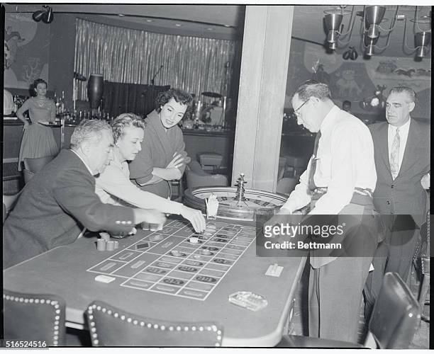 Las Vegas, Nevada: Marguerite Piazza is shown watching two guests of the Sands Hotel play the roulette wheel at the Sands. Marguerite Piazza will be...