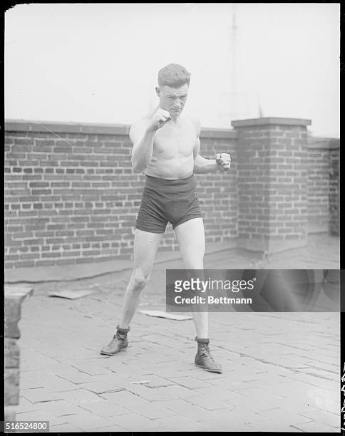 Bobby Barrett, lightweight fighter who knocked out Heine Gold the other night, is shown. Barrett and his manager are now in New York--Jim Doughtery...