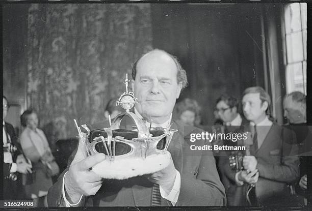 The nearly completed coronet which will be used for the investiture of Prince Charles July 1st, is shown here publicly for the first time by Louis...