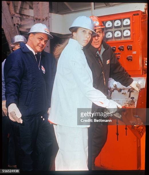 Great Yarmouth, England: Princess Anne of Great Britain wears white nylon overalls and safety helmet, as she became the first woman ever to visit the...