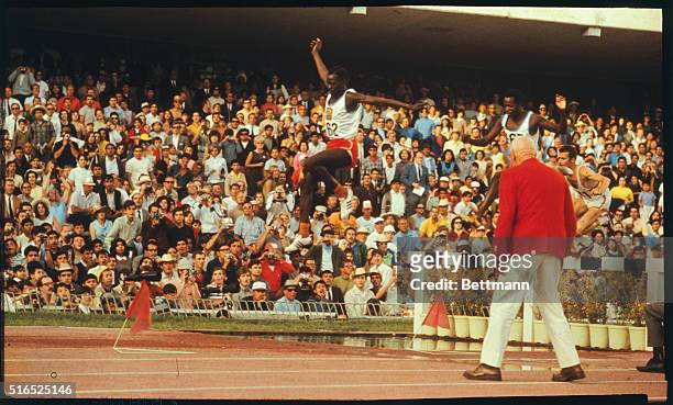 Mexico City: Amos Biwott of Kenya takes a hurdle on his way to Gold medal victory in the 3,000-meter Steeplechase, in the 1968 Olympics.