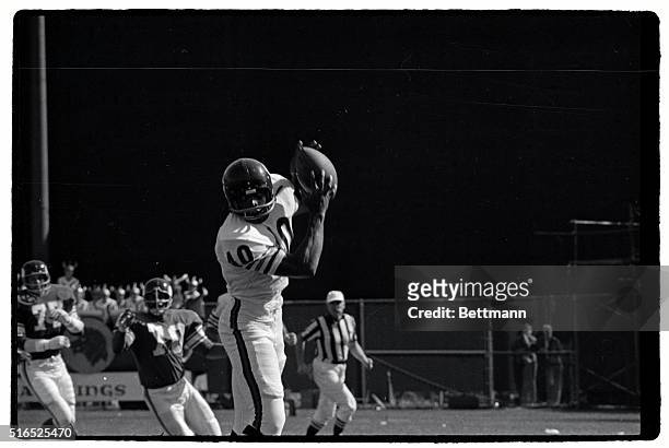Gale Sayers of the Chicago Bears catches a pass in a game against the Minnesota Vikings.