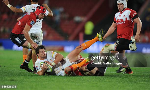 Francois Venter of Cheetahs is tackled by Andries Ferreira of Lions during the Super Rugby match between Emirates Lions and Toyota Cheetahs at...