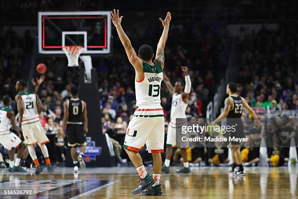 Angel Rodriguez of the Miami Hurricanes celebrates defeating the Wichita State Shockers 65-57 during the second round of the 2016 NCAA Men's...