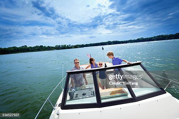 family summer boating on a lake - motorboot varen stockfoto's en -beelden