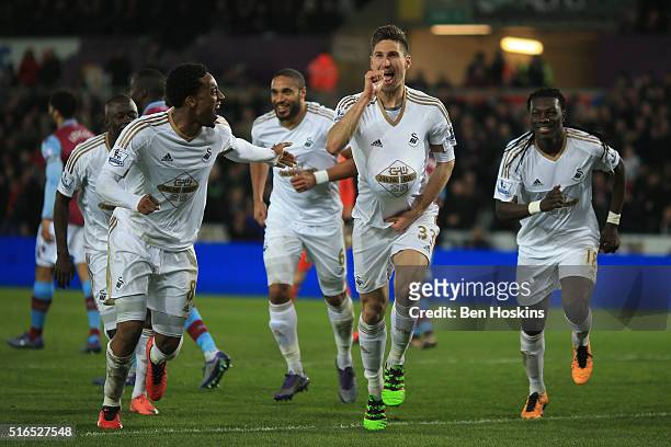 Federico Fernandez of Swansea City celebrates scoring his team's first goal with his team mates during the Barclays Premier League match between...