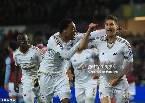 Federico Fernandez of Swansea City celebrates scoring his team's first goal with his team mate Leroy Fer during the Barclays Premier League match...