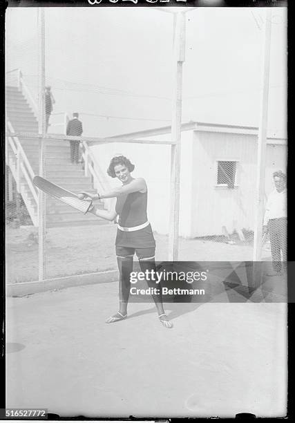 Brooklyn, New York: Cuban Handball Hits Brighton. Miss Anna Price, of Bensonhurst, L. I., trying the game of "Hyalie" otherwise Cuban Handball - at...