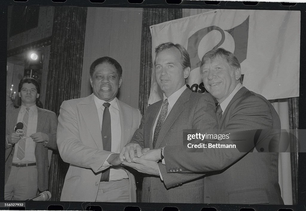 Peter Ueberroth Joining Hands with Baseball Players