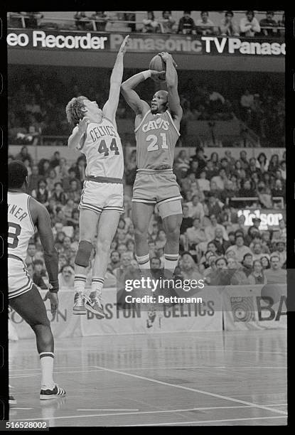 Boston, Massachusetts: Celtics guard, Danny Ainge , attempts to block Cavaliers guard, World B. Free, as he goes up for two during third quarter...