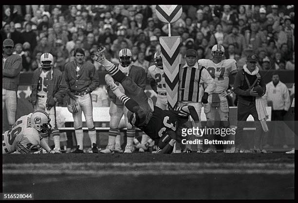 San Francisco 49er FB Roger Craig is shown landing with the ball for the first down during Super Bowl XIX against the Miami Dolphins 1/20.