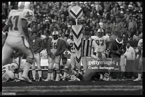 San Francisco 49er FB Roger Craig is shown on the ground with the ball during Super Bowl XIX against the Miami Dolphins 1/20.