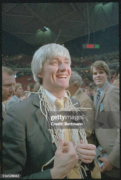 Atlanta: Georgia Tech coach Bobby Cremins is all smiles as he wears the game net after his 11th ranked team beat 7th ranked UNC to win the ACC...