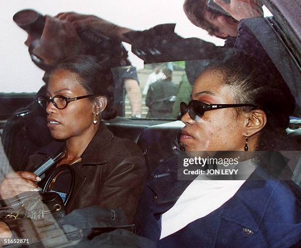 Qubilah Shabazz and her sister Ilyasah wait in a car 03 June outside family court in Yonkers after attending a court hearing for Qubilah's son...