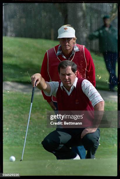 Photos include general crowd and course scenes, action shots of Curtis Strange, action shots of winner Mark O'Meara and O'Meara with trophies.