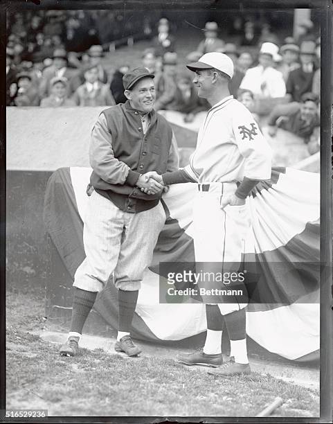 Rogers Hornsby of the Braves and Travis Jackson of the Giants, both their teams respective captains, shaking hands before the season opener at the...