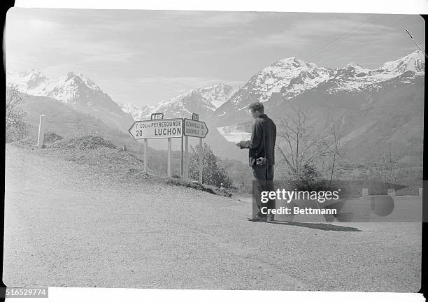 View of Pedestrian Standing at Road Scene High in Pyrenees Mountains