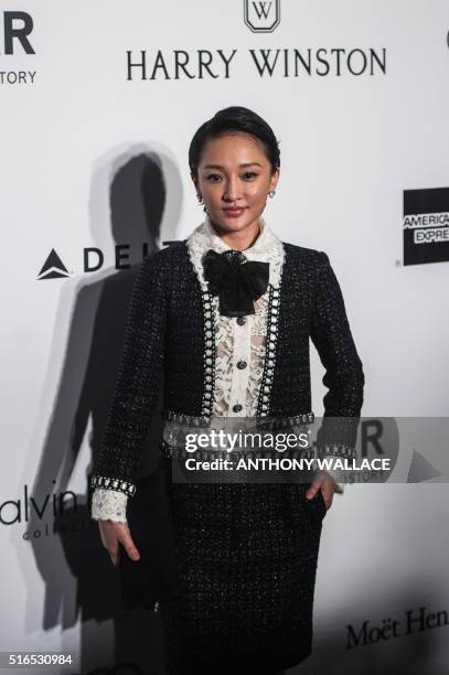 Zhou Xun poses on the red carpet during the 2016 American Foundation for AIDS Research Hong Kong gala at Shaw Studios in Hong Kong on March 19, 2016....