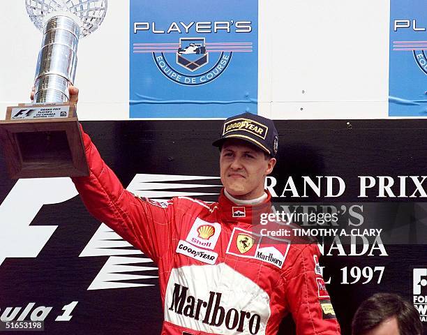 Formula One Team Ferrari driver Michael Schumacher of Germany holds up his trophy after wnning the The Grand Prix of Montreal 15 June at the Circuit...