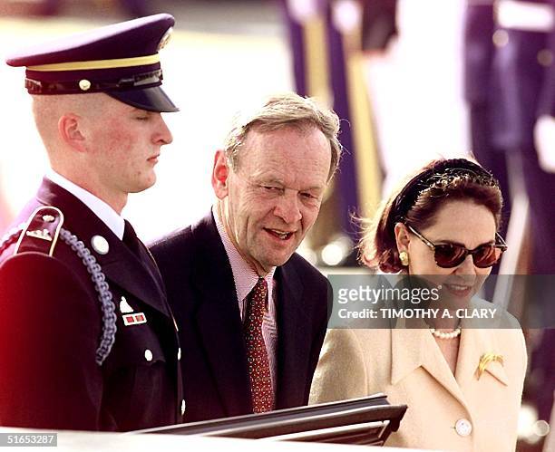Canadian Prime Minister Jean Chretien and his wife Aline get into their limousine after arriving at Denver International Airport 19 June for the...