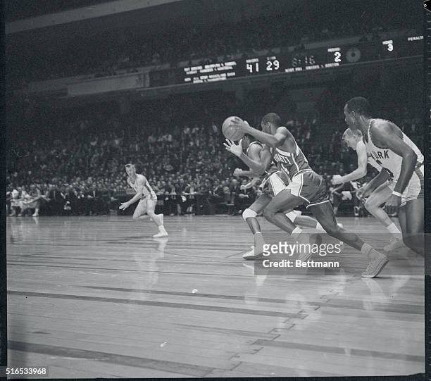 New York, New York: Oscar Robinson drives up-court after stealing pass meant for Knicks' Willie Naulls .
