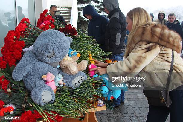 Flowers lie on a desk outside the airport building in Rostov-on-Don where a plane crashed killing all 62 people onboard on March 19, 2016. A Dubai...