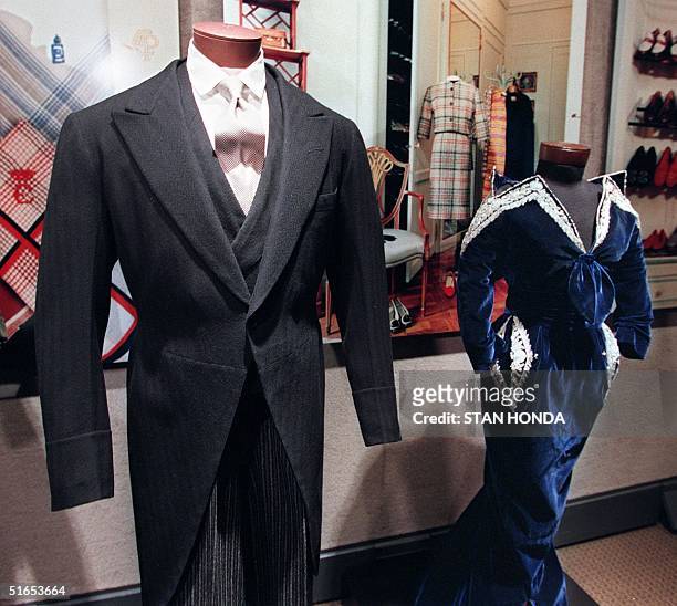 Morning coat and trousers worn by the Duke of Windsor and a Christian Dior evening gown worn by the Duchess of Windsor are on display 07 July at...