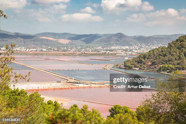 colorful saltpans in the island of ibiza. - cloud sales fotografías e imágenes de stock