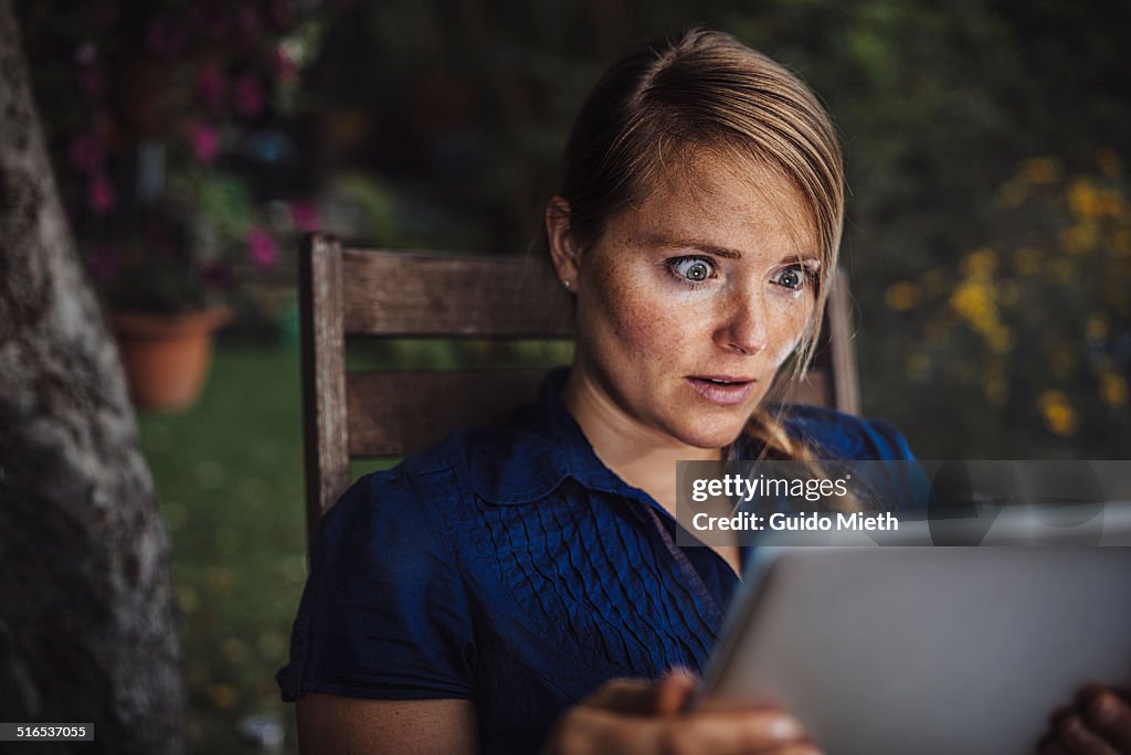 Woman using smart device.