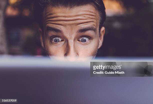 man using tablet pc. - disbelief stock pictures, royalty-free photos & images