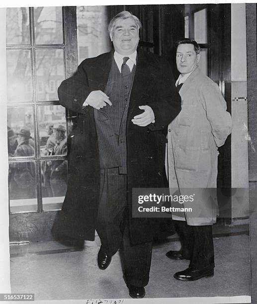 Aneurin Bevan, beaming confidence, is shown arriving at transport house to face a loyalty test by a committee of eight appointed to decide whether he...