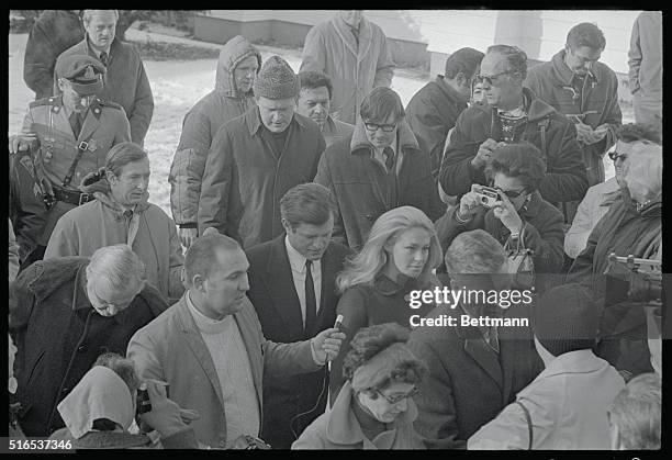 Edgartown, Mass.: Sen. Edward M. Kennedy is questioned by newsmen on the steps of the Dukes County Courthouse he and his wife Joan left court, where...