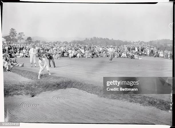 Harry Cooper plays from edge of traps at 14th hole at Open. Armour at right.