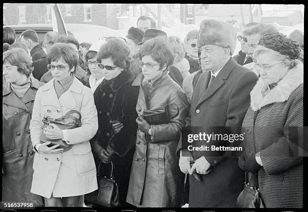 St. Bruno, Quebec: The three surviving Dionne Quintuplets, left to right, Yvonne, Annette, and Cecile as they are seen at the burial site of their...