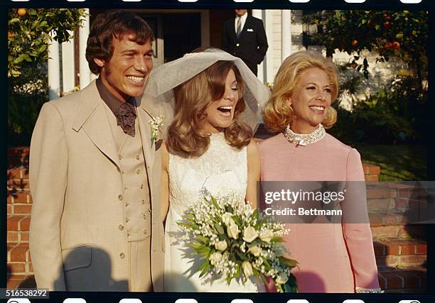 Los Angeles, California: At the wedding of David Lee Burk and Melissa Ann Montgomery, the bride and groom are shown with the bride's mother, Dinah...
